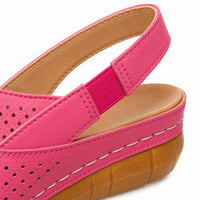 Halvine Women's Perforated Wedge Slingback Sandal in Pink