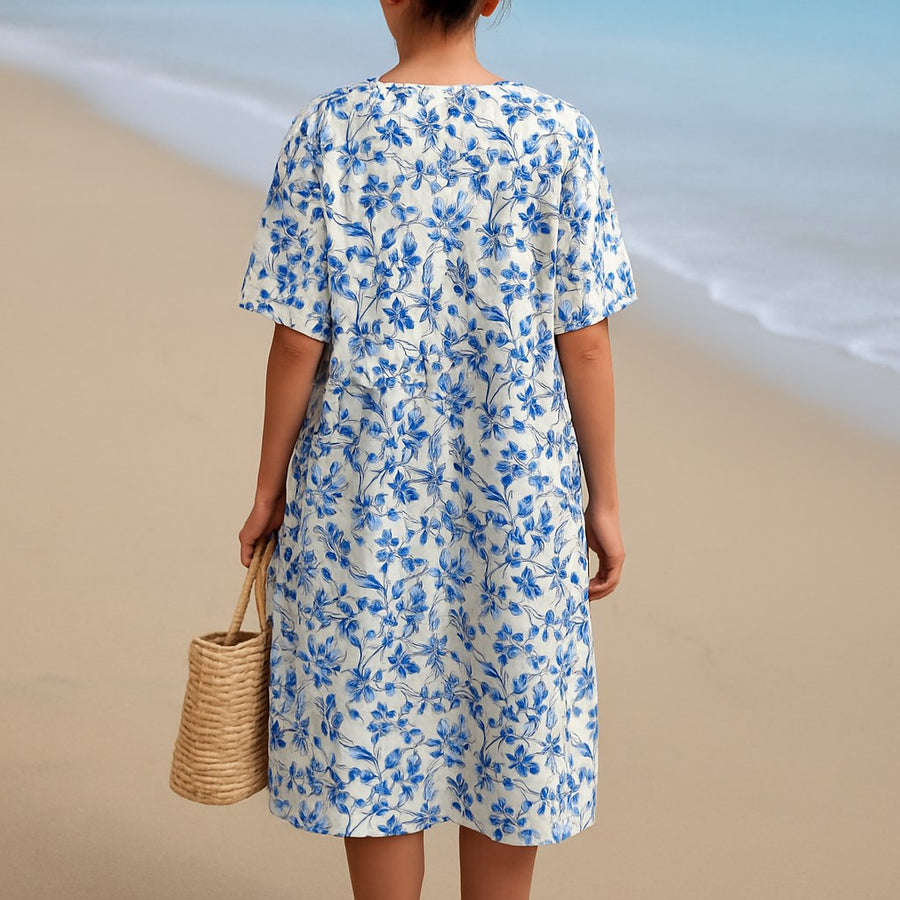 Madeline™ Ivory Dress Adorned with Porcelain Blue Floral Accents in Blue