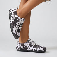 Sadie Cow Print Sneaker in Black Cow