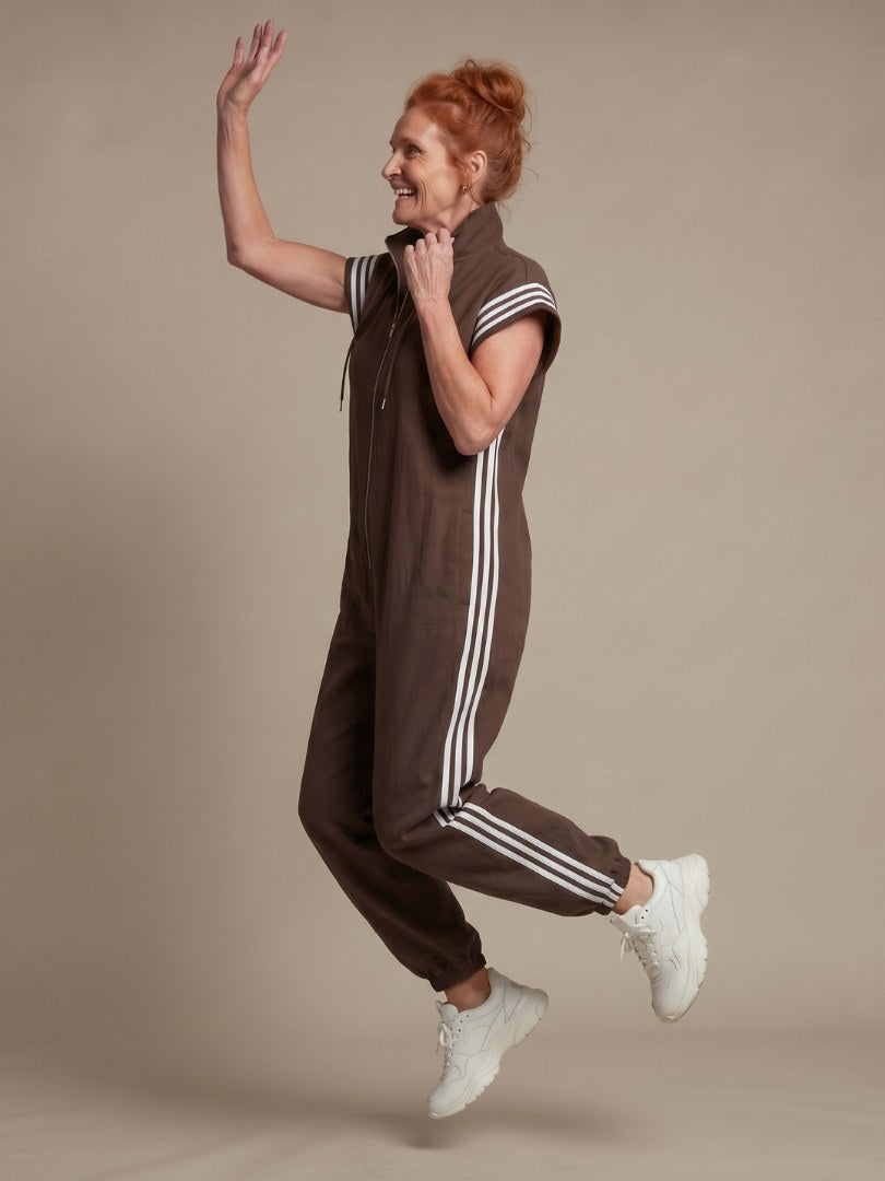 Vashti Women's Zip Front Stripe Panel Jumpsuit in Brown