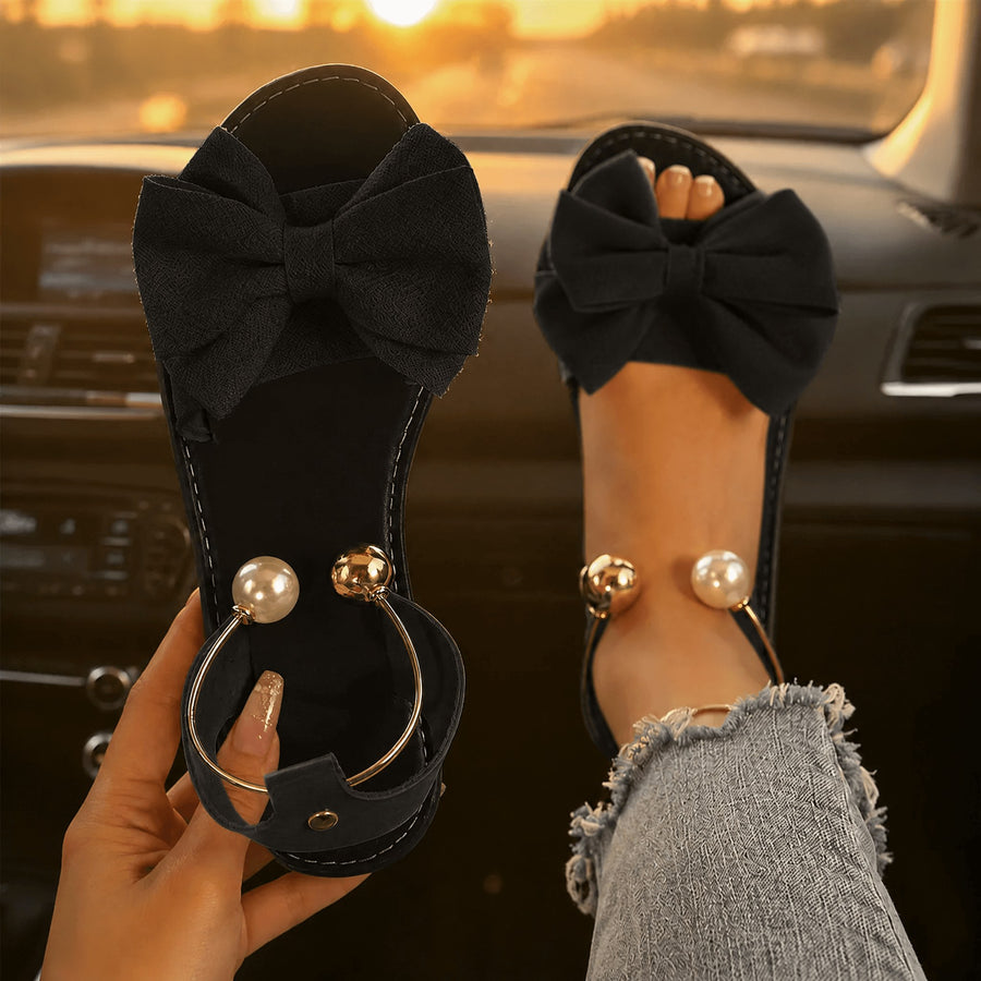 Vennla Women's Bow Flat Sandals with Pearl Ankle Cuff in Black